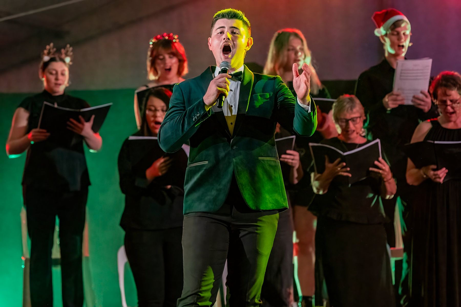 Dylan Forge singing at a Carols by Candlelight concert