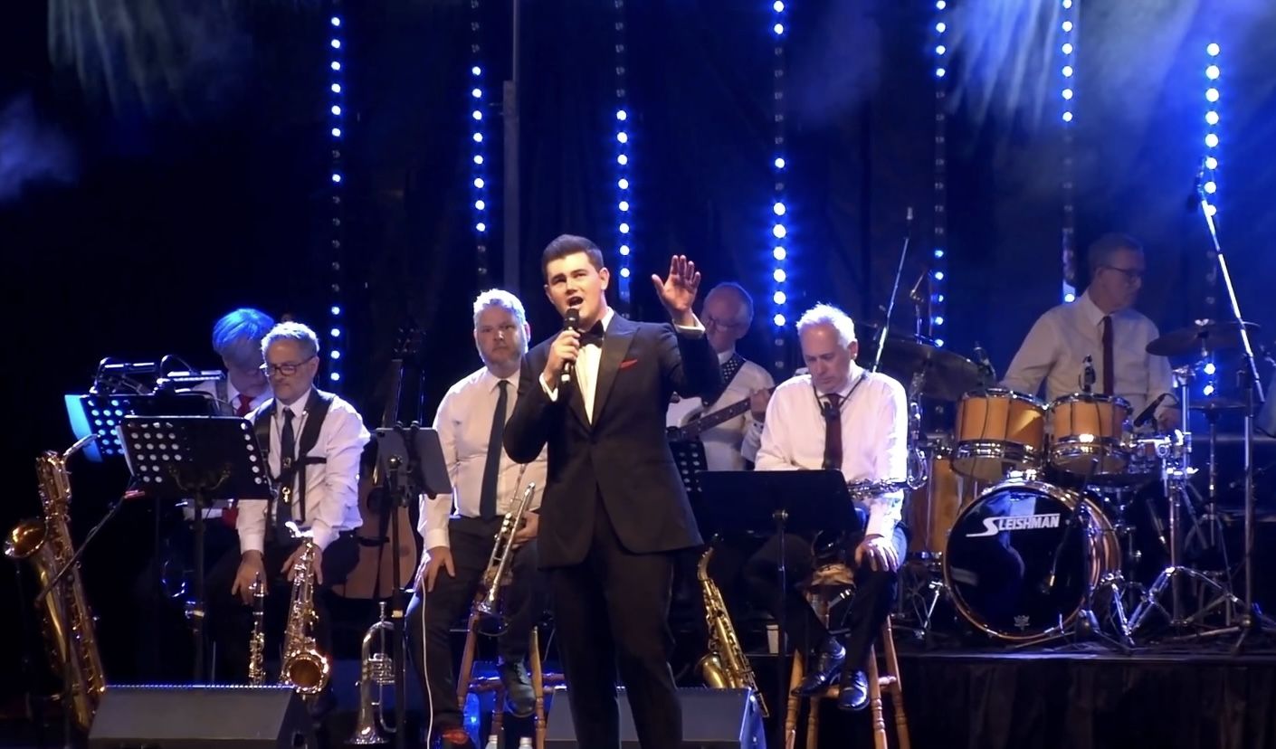 Dylan Forge performing for a venue audience